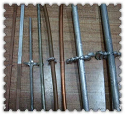 Welding dies set up in a machine for a test joint