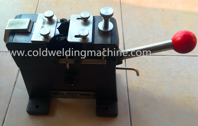 SGT DA10 desk cold welder with copper wire clamped in the welding dies