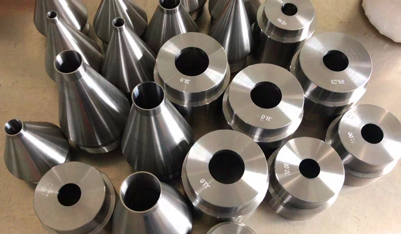 Row of SGT tungsten carbide extrusion dies for insulated wire and cable lines