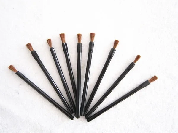 Six disposable lip brushes with soft pony hair tips and black plastic handles