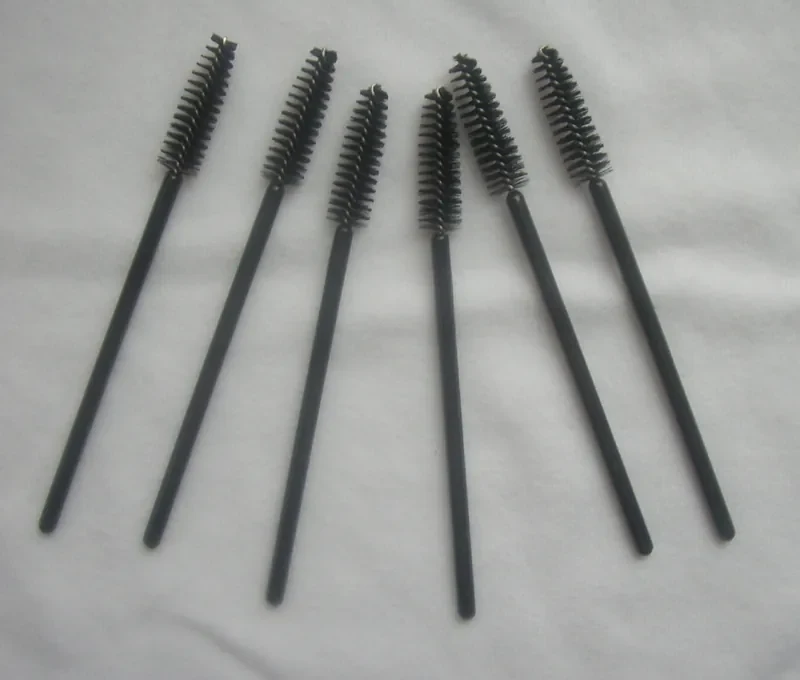 Disposable mascara wands with spiral nylon bristles and black handles