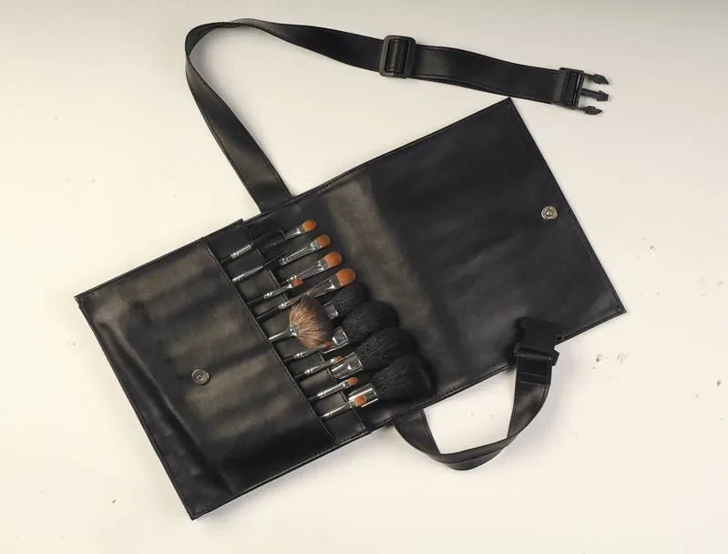 Professional waist brush set in an open black PU pouch with a strap