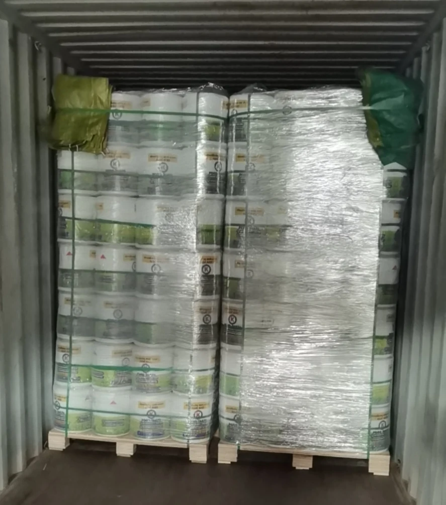 Container loaded with palletised baler twine cartons