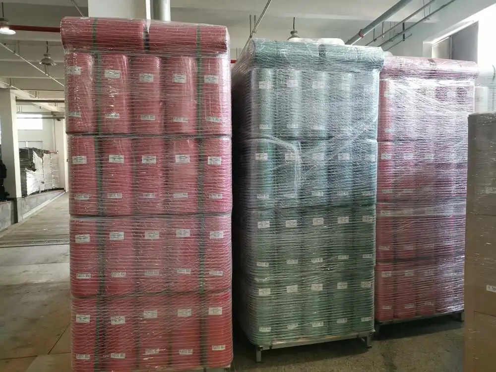 Palletised coloured net wrap rolls in the warehouse