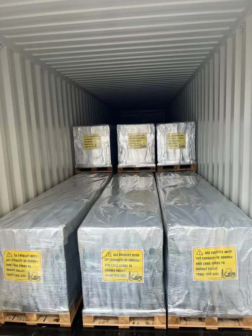 Cartons of agricultural film stacked on export pallets