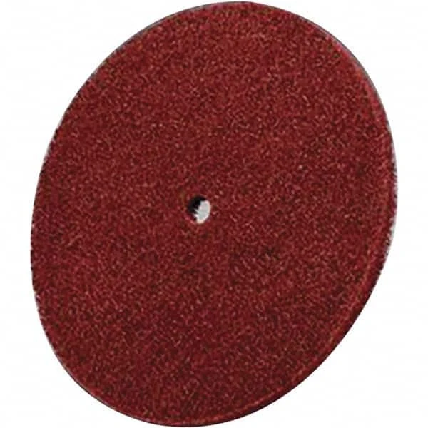 8447 red nonwoven polish disc mounted on a power tool arbor