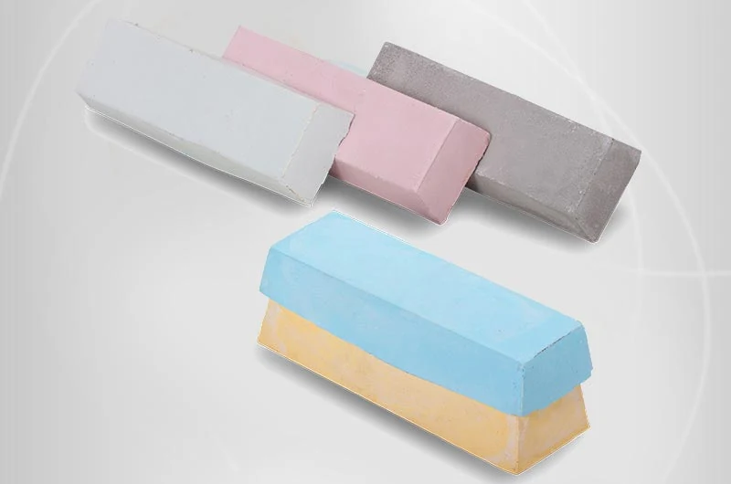 Bar Polishing Compound in solid bar form, placed on a metal surface