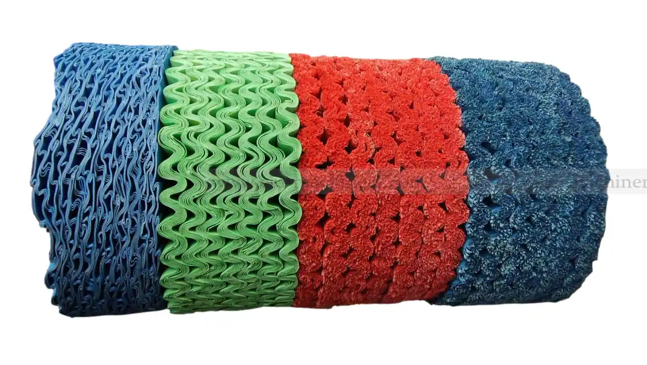 Rolls of corrugated sisal and treated cloth buffing wheel material in blue green and red