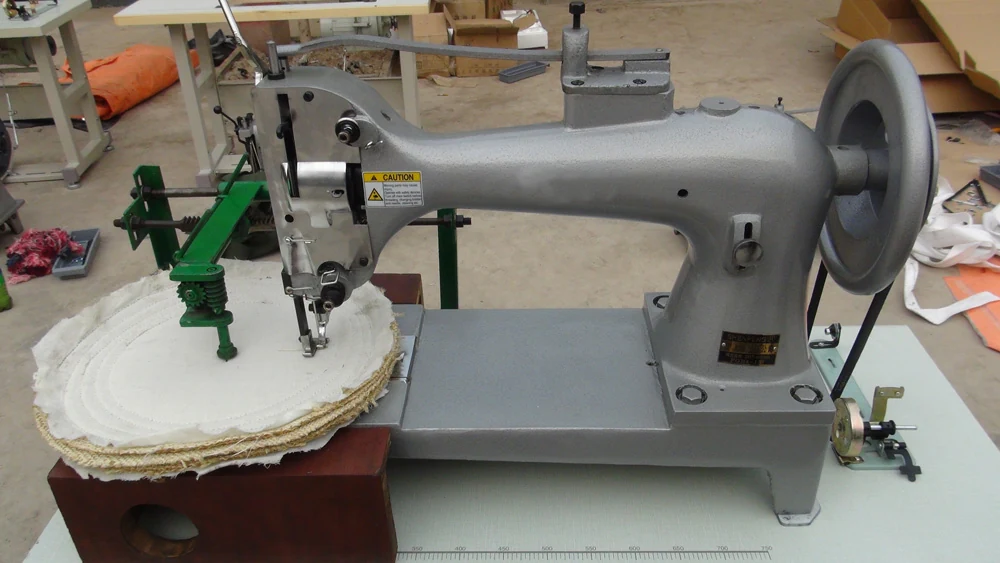 Buffing wheel being spiral stitched on an SG01M sewing machine in the CRATOOLS workshop