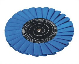 Blue treated round hole airway cotton polishing wheel on a metal arbor shaft