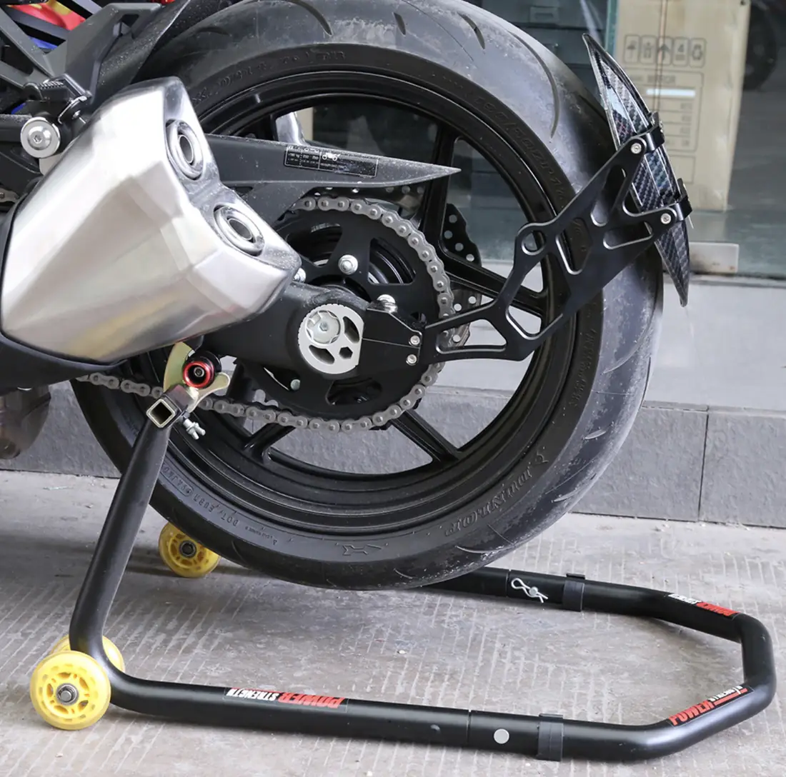 Motorcycle held on a paddock stand in a workshop