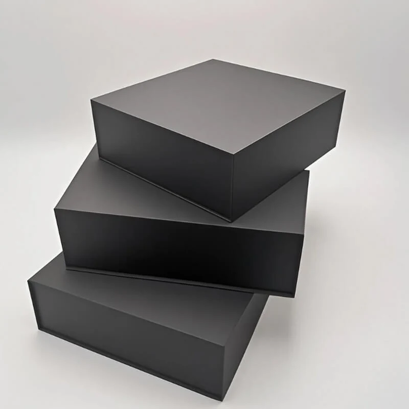 Black cosmetic gift box with fitted insert holding bottles