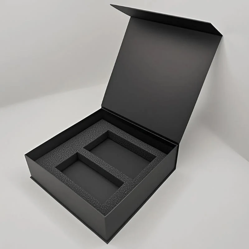 Magnetic closure detail on the black book-shaped beauty box