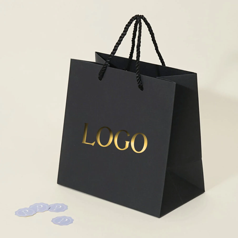 Custom printed luxury paper bag with fabric handles and gold foil logo