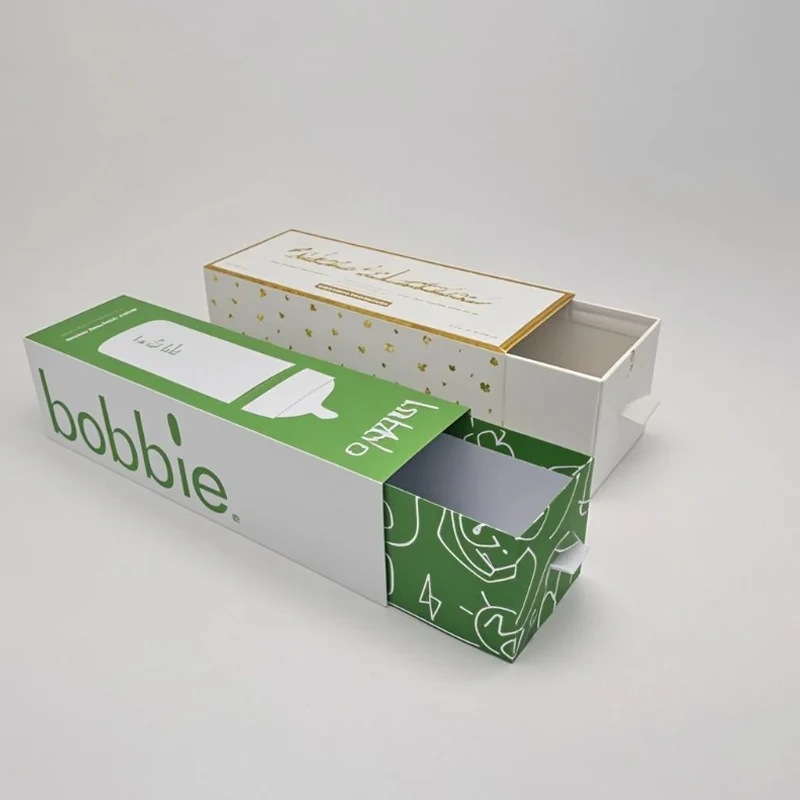 Drawer box with fitted tray holding baby care items