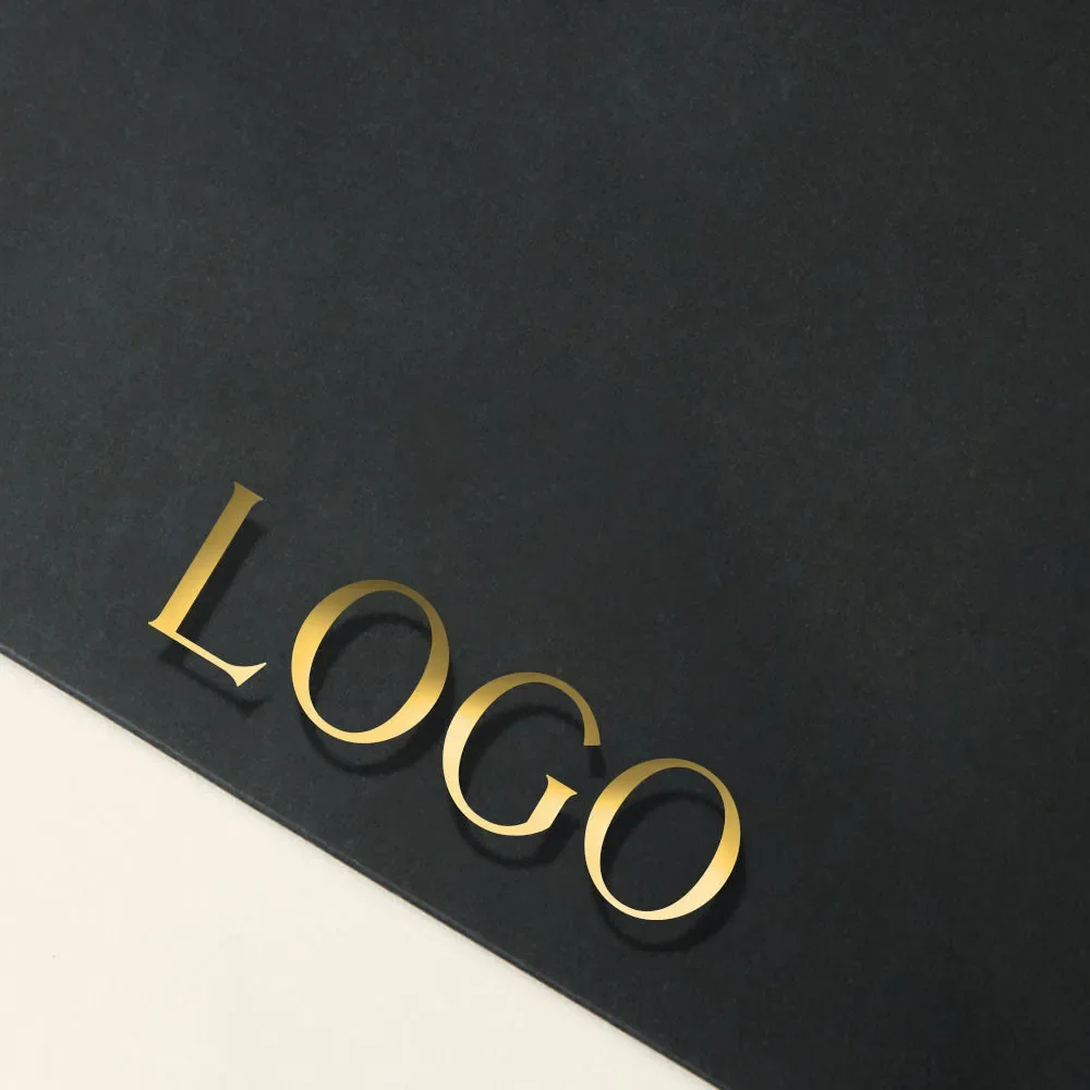 Black paper bag with a gold foil logo