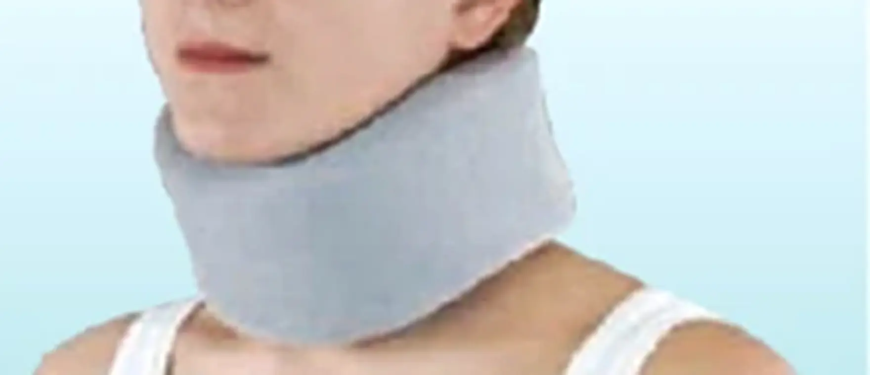 Medical grade foam cervical collar fitted on a patient