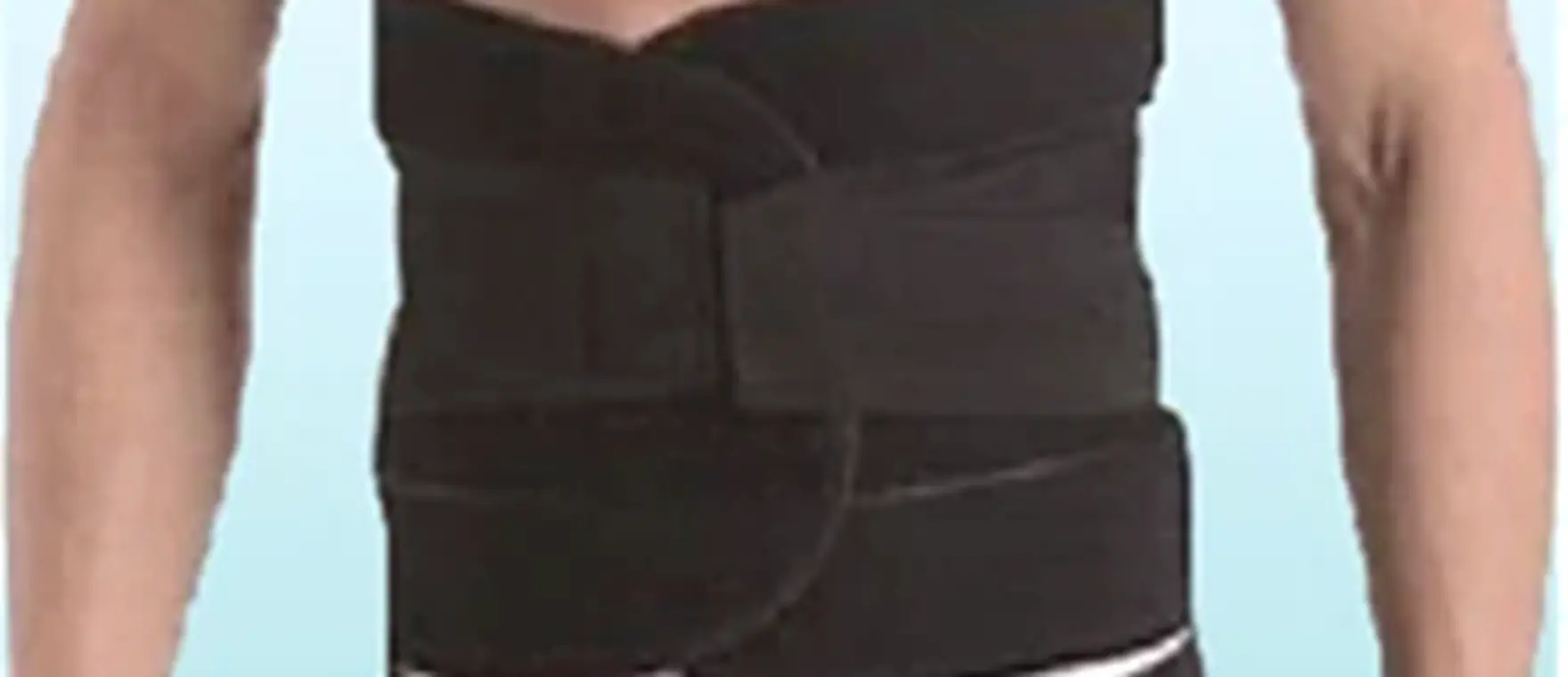 Lumbar support belt with dual adjustment panels fitted on a patient