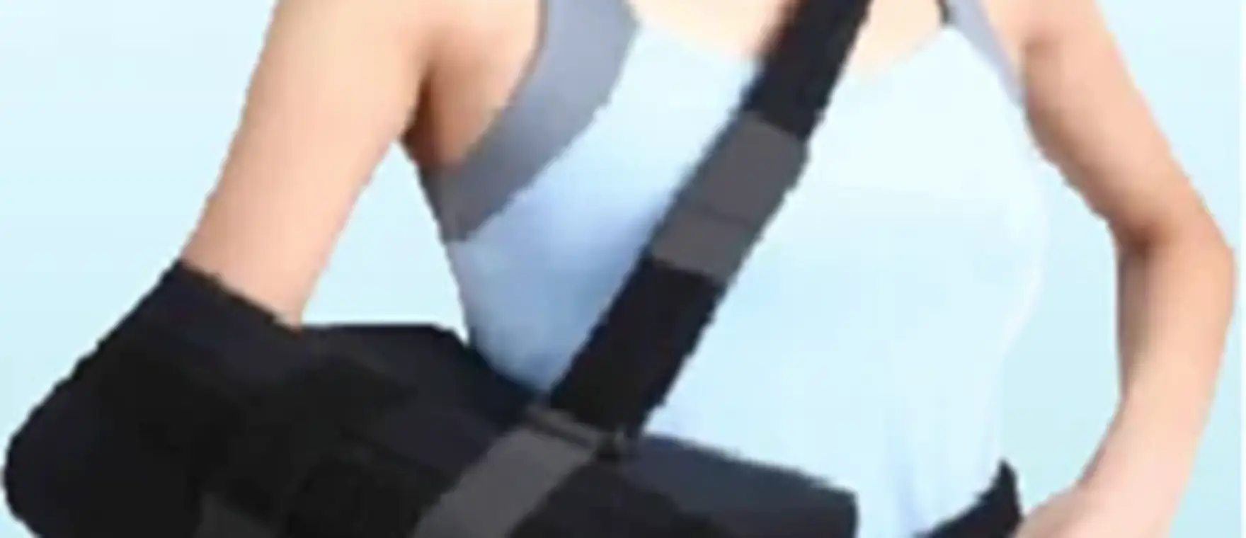 Shoulder abduction sling with abduction pillow fitted on a patient