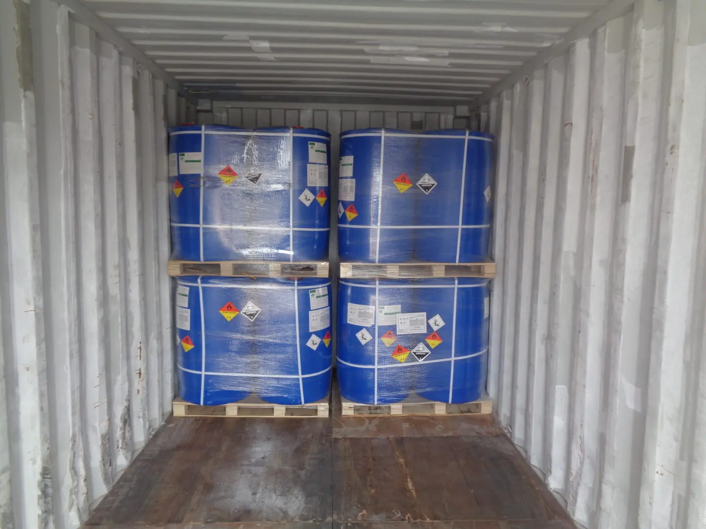 Drums and totes staged for loading in the Dakings export container yard