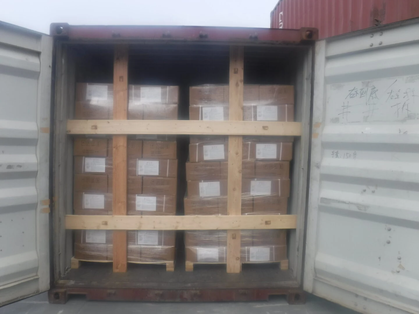 Cased intermediates braced with timber dunnage inside an export container