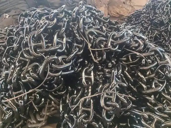 Stud link anchor chain coiled in the yard