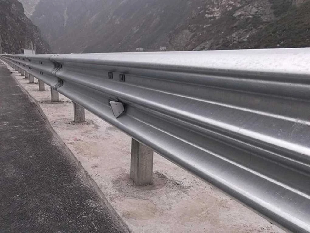 Galvanized thrie-beam guardrail sections stacked in the Hongda finished product area