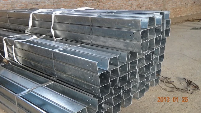 Open box beam installed along a bridge deck with galvanized posts