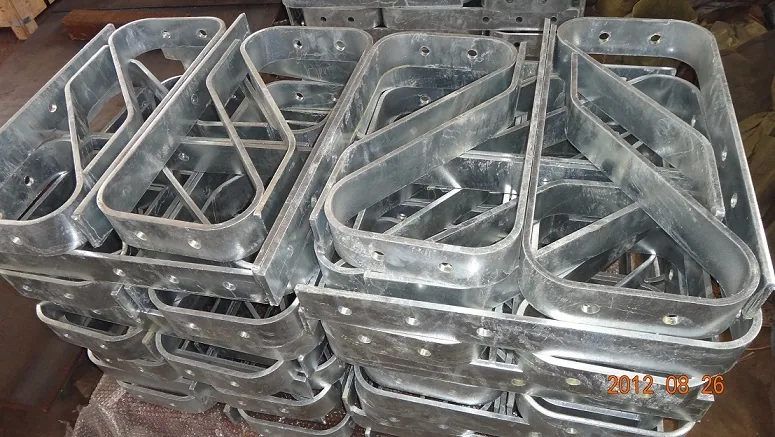 Close-up of the precision-bent and plasma-cut profile of the spring steel buffer, highlighting the smooth radius and galvanized surface