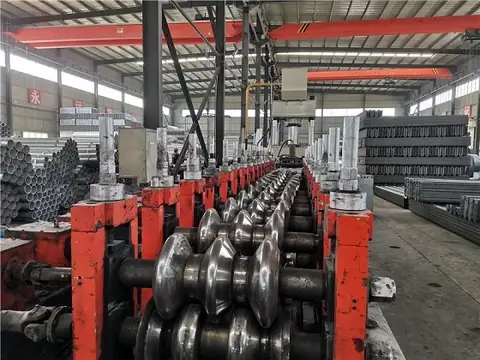 Semi-finished product area holding formed sections between roll forming and galvanizing