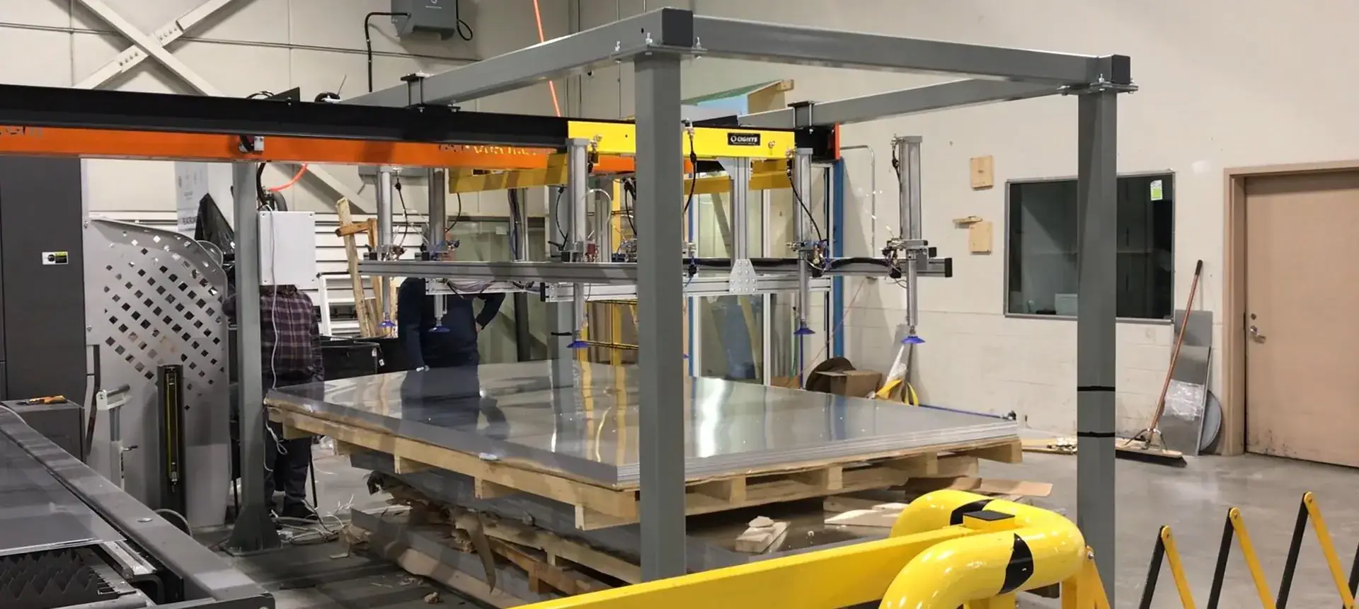 Delkotech automatic pick and place cell feeding blanks into a laser cutting machine