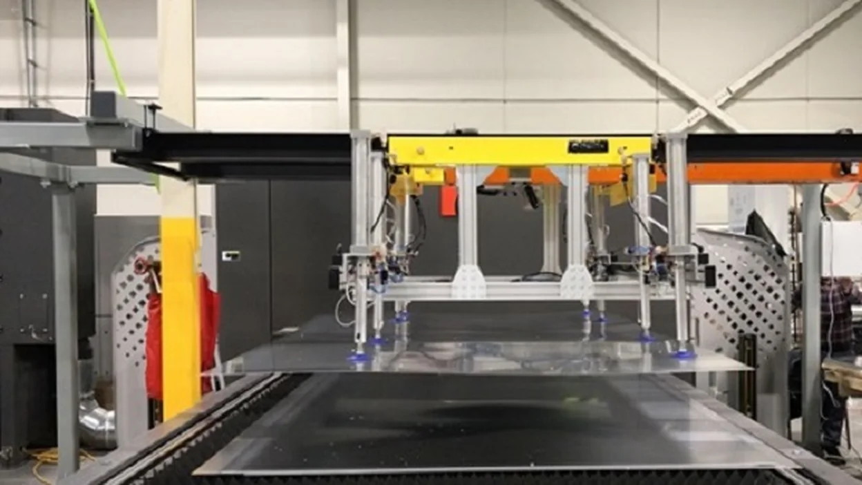 Delkotech gantry pick and place cell installed alongside a laser cutting machine