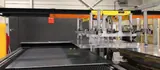 Sheet metal blank travelling into the laser cutting machine on the Delkotech conveyor