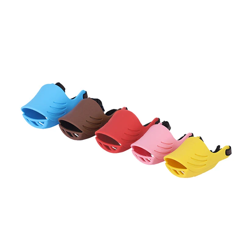Adjustable silicone dog muzzle in red with sliding clip and woven strap