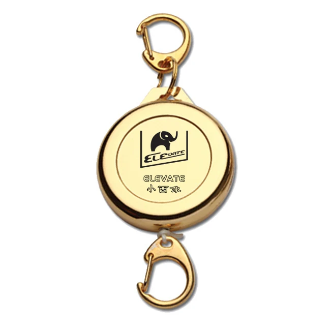 Metal ELEVATE retractable ski pass holder in gold with metal hook and belt clip