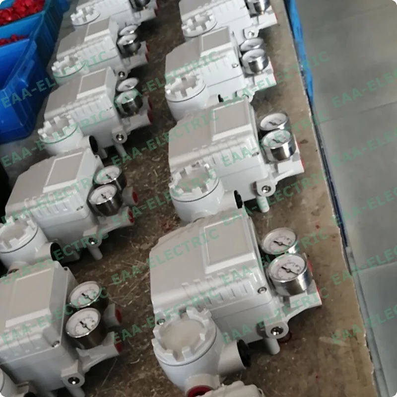 Valve positioners with gauge blocks fitted, laid out for final inspection before packing