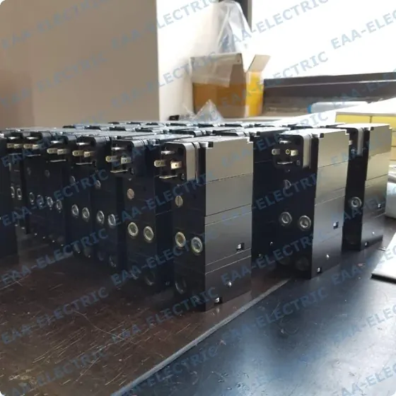 Finished valve positioners with customer nameplates fitted, photographed in the EAA Electric warehouse before packing