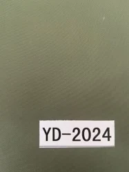 Roll of YD-2023 fabric with label indicating composition and weight