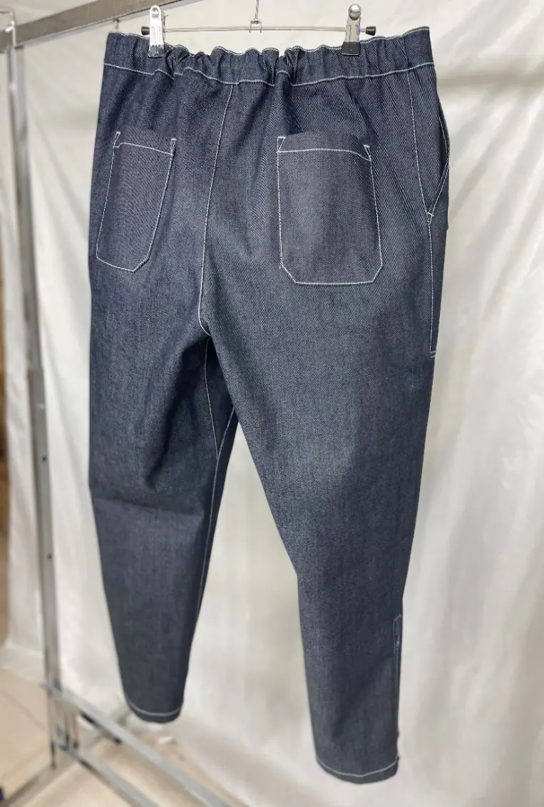 Cross-section view of the three-layer construction: cotton shell, PU mid layer, polyester inner fabric