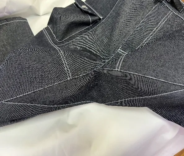 Side profile of the jeans showing seam details and fabric thickness