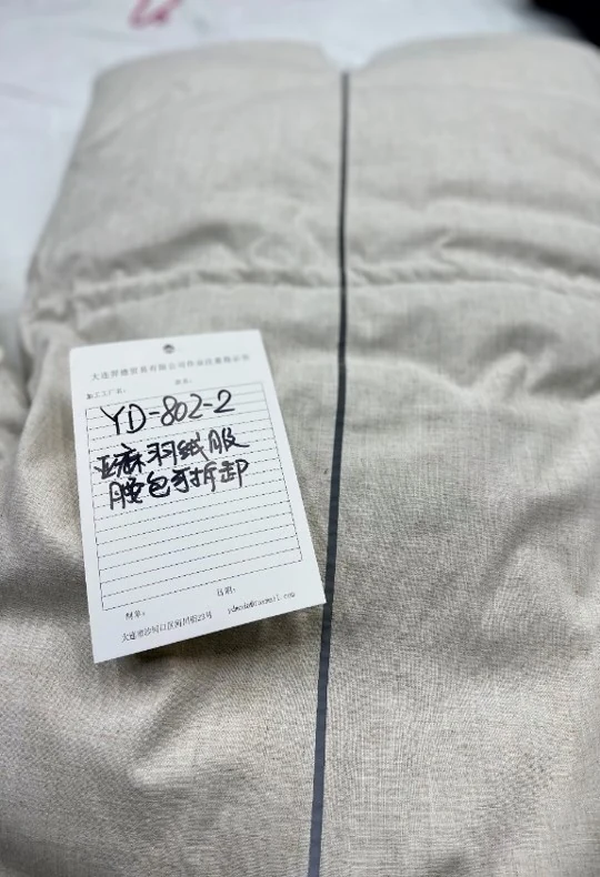 Close-up of the coat's shell fabric showing linen and royan blend