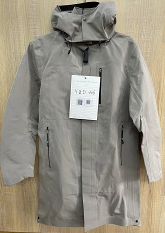 YD306 outerwear garment in neutral tone with textured fabric surface