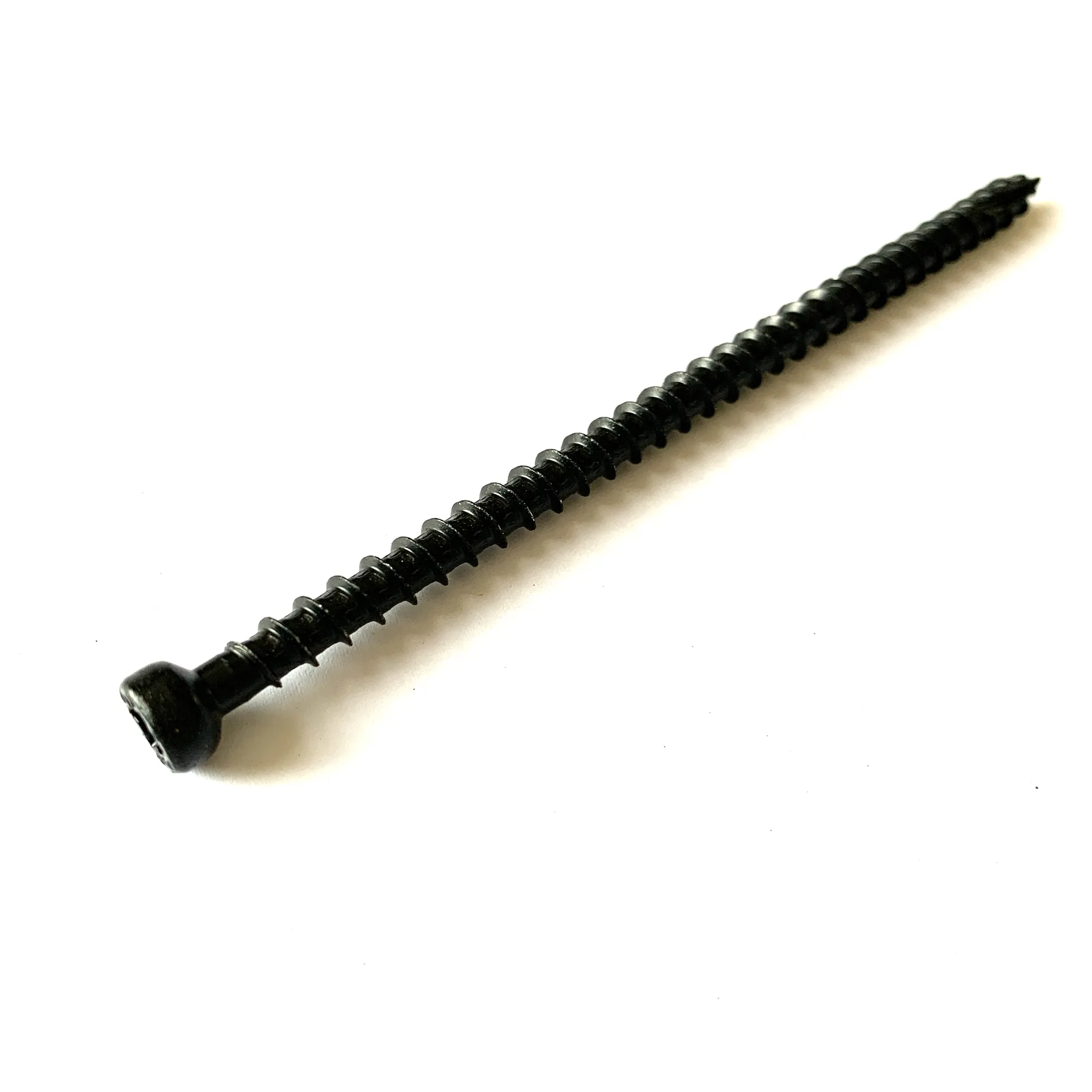 Long dark coated concrete screw with a serrated cutting thread