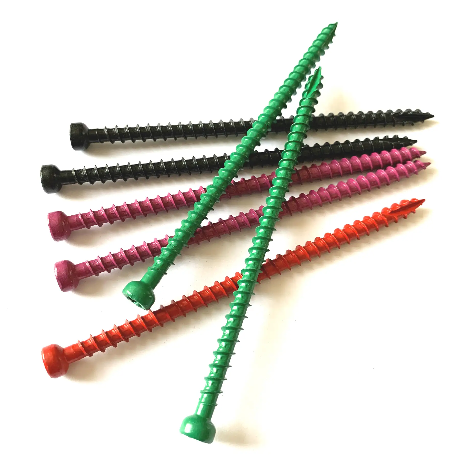 Concrete screws in black, green, red and pink coatings laid side by side