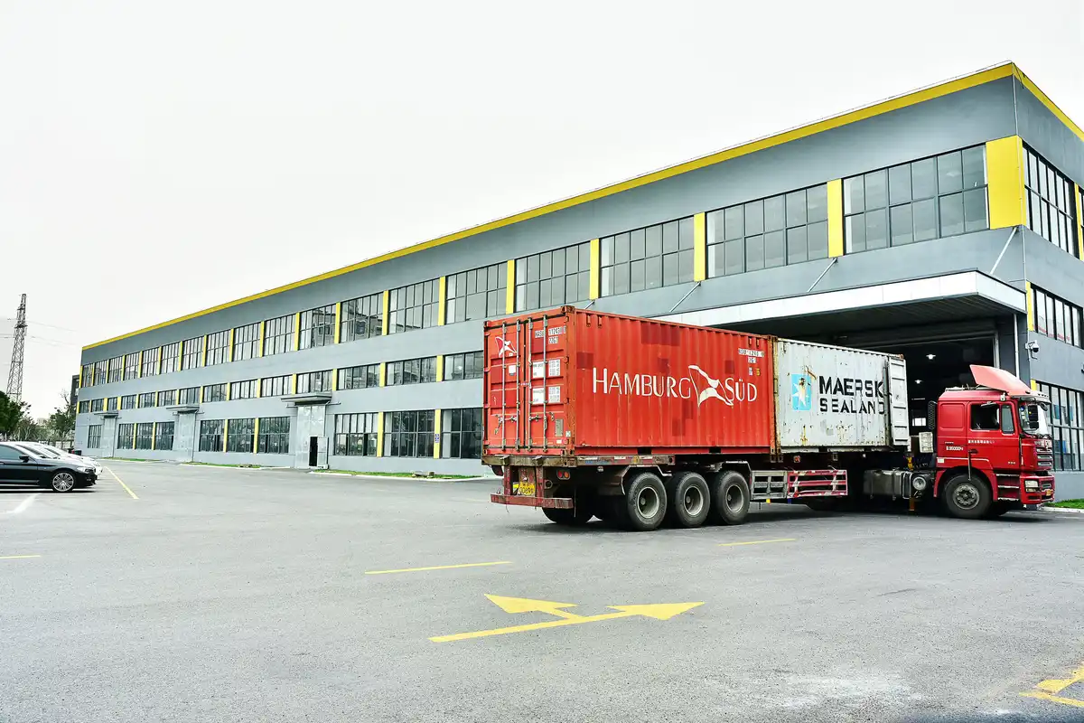 Pallets being moved into a container for export