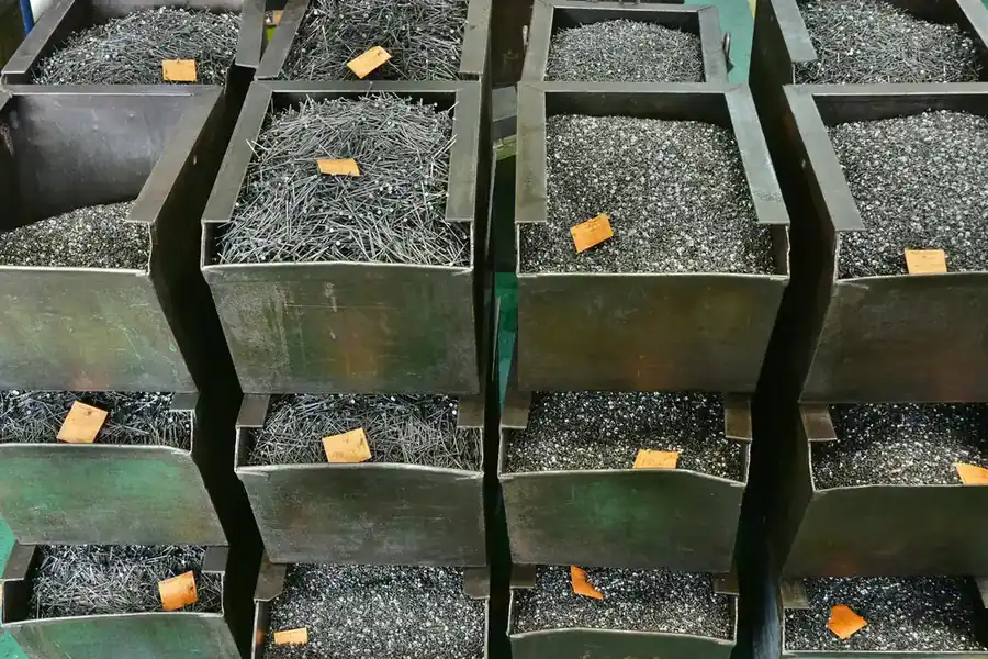 Steel wire and part-formed blanks staged in labelled bins