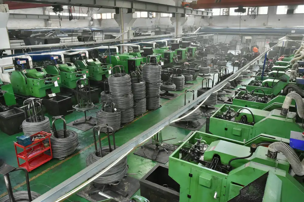Rows of cold heading machines running in the Ehons production workshop