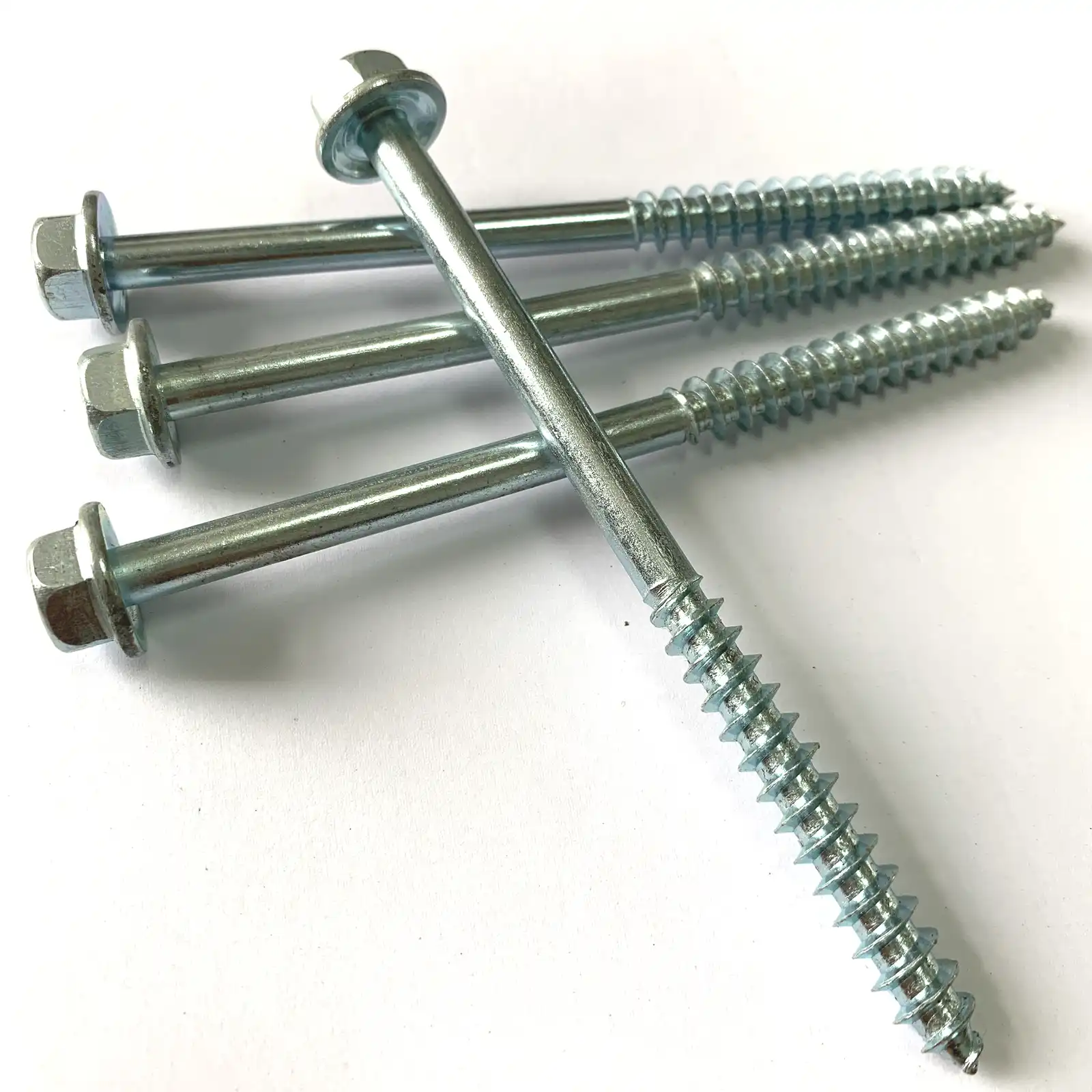 Hexagon head wood screws of several lengths laid out together