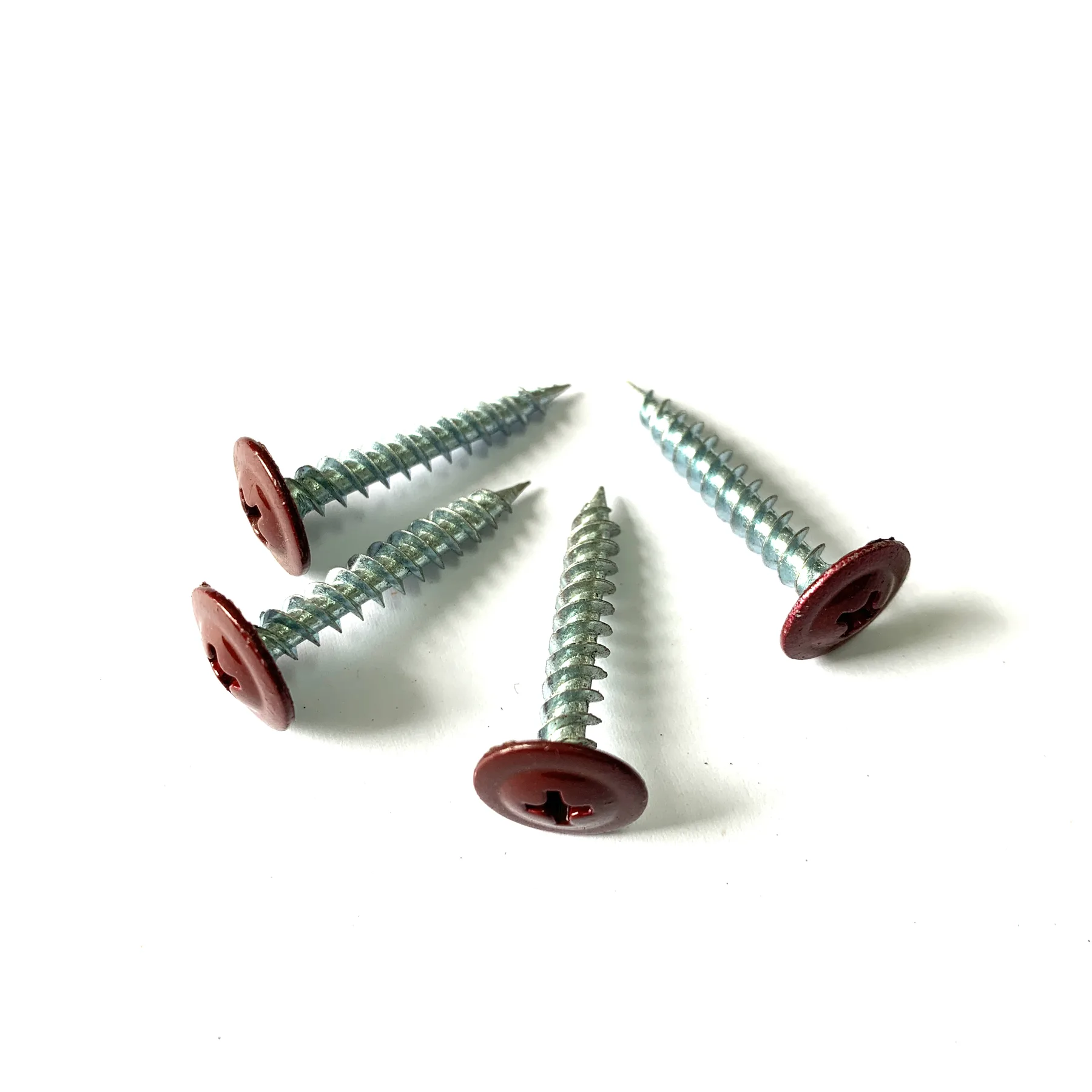 Side view showing the wide flat crown of a modified truss head screw