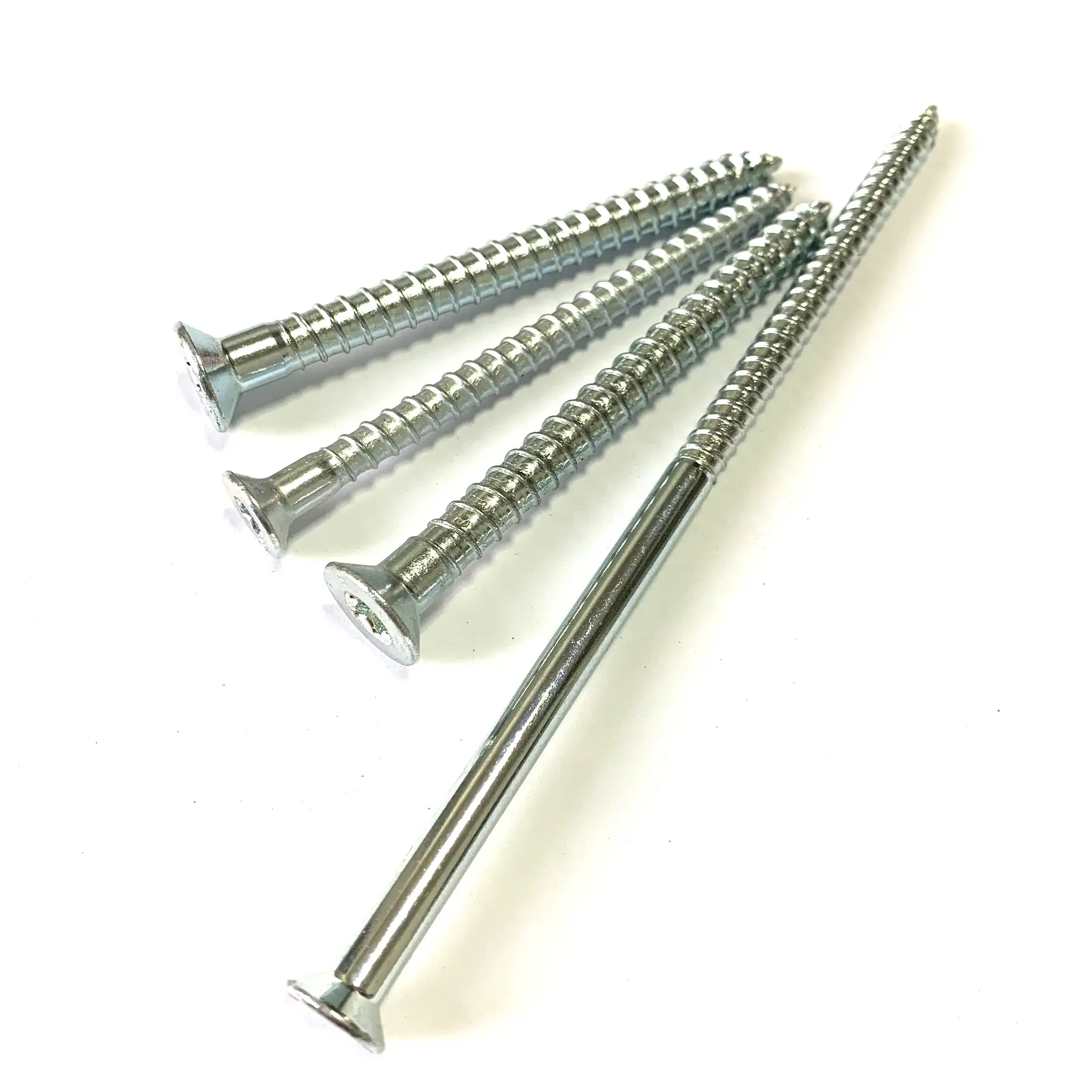 Long zinc plated countersunk wood screws with Torx recess laid in a group
